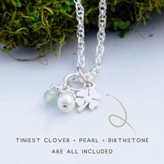 Eeek! It's so itty bitty. This tiniest lucky clover necklace is part of our teenie tiny line, and it's oh-so-precious. The smallest lucky four-leaf clover charm (measuring an itty bitty 5mm across) lays next to her very own birthday gem, and a tiny cultured freshwater pearl. It is just the cutest way to remind her that lady luck is on her side through all of her adventures. This necklace includes: tiniest clover charm...ever (seriously, SO tiny - about 5mm across) tiny cultured freshwater pearl Dainty Sterling Silver Charm Necklace For May Birthstone, Dainty Sterling Silver Charm Necklaces For May Birthstone, Dainty Flower Pendant Charm Necklace For Good Luck, Dainty Personalized Good Luck Charm Necklaces, Green Jewelry For Good Luck, May Birthstone, Dainty Good Luck Flower Pendant Charm Necklace, 4leaf Clover Necklace, Four Leaf Clover Necklace Silver, Four Leaf Clover Charm