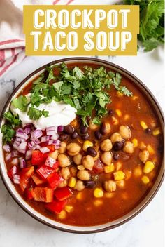 a bowl filled with taco soup and garnished with cilantro