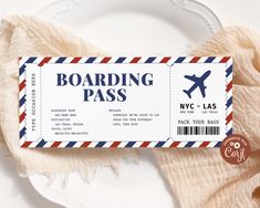 a boarding pass sitting on top of a white plate