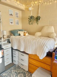 a bedroom with a bed, dressers and other items on the floor in it