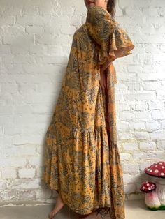 This is oversized bohemian style maxi dress great for all year round. Free size, makes it perfect fit for all ladies, great for maternity. Made in very light silky soft material, ultra long, with ruffles and long sleeves. Bright yellow material with floral patterns. Very loose extra large fit XL shoulder/ bust 20 -22 inch hips very loose and wide length 57 inch Thank you for looking Flowy Floral Print Midi Dress Beach Cover-up, Flowy Printed Long Maxi Dress, Oversized Dress With Kimono Sleeves For Summer, Oversized Summer Dress With Kimono Sleeves, Flowy Long Printed Maxi Dress, Modest Long Midi Summer Dress, Oversized Bohemian Tunic For Beach Cover-up, Floral Print Free Size Maxi Dress For Beach, Free Size Long Floral Print Maxi Dress