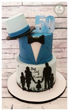 a cake decorated with an image of two people and a top hat