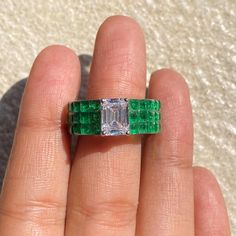 Emerald ring featuring semi precious green stone and cz diamonds in an invisible setting. Ideal to pair with your formals to special occasion outfits. Perfect Gift for her. *𝐏𝐑𝐎𝐃𝐔𝐂𝐓 𝐃𝐄𝐓𝐀𝐈𝐋* * 𝐌𝐚𝐭𝐞𝐫𝐢𝐚𝐥: Brass * 𝐏𝐥𝐚𝐭𝐢𝐧𝐠: White Rhodium Plated * 𝐒𝐭𝐨𝐧𝐞: AAA-quality CZ Diamond & Emerald. *𝐃𝐈𝐌𝐄𝐍𝐒𝐈𝐎𝐍𝐒* * 𝐖𝐞𝐢𝐠𝐡𝐭: 6 gm * 𝐖𝐢𝐝𝐭𝐡: 0.8 Inch * 𝐒𝐢𝐳���𝐞: 5.5  fits upto 6 𝐕𝐢𝐬𝐢𝐭 𝐎𝐮𝐫 𝐅𝐀𝐐𝐬 𝐟𝐨𝐫 𝐒𝐡𝐢𝐩𝐩𝐢𝐧𝐠 𝐏𝐨𝐥𝐢𝐜𝐢𝐞𝐬 𝐚𝐧𝐝 𝐂𝐚𝐫𝐞 𝐈𝐧 Ring Bride, Emerald Band Ring, Bride Wedding Gift, Luxury Green, Emerald Band, Ring Luxury, Wide Band Ring, Emerald Diamond Ring, Wedding Gifts For Bride