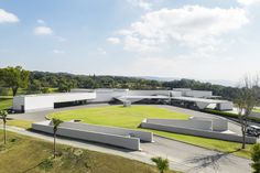 an aerial view of a building surrounded by trees