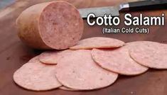 several slices of italian cold cut salami on a cutting board