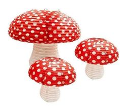 red and white paper lanterns with polka dots on them, set of three mushroom - like decorations