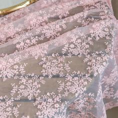 pink and white floral lace on sheer fabric