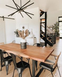 a dining room table with chairs around it