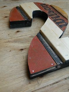 a wooden letter shaped like a basketball