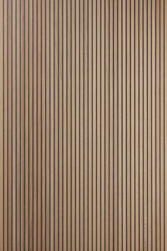 a close up view of a wooden wall with vertical blinds