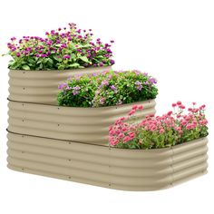 three planters filled with flowers on top of each other