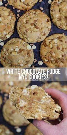 white chocolate fudge cookies are being held up by someone's hand and the cookie is half eaten