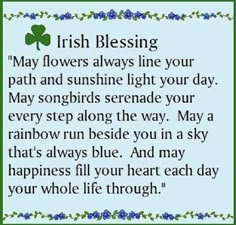 irish blessing with shamrock leaves and blue flowers on the border, says may flowers always line your path and sunshine light your day