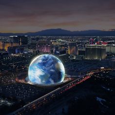 an artist's rendering of the planet in las vegas, with buildings and mountains in the background