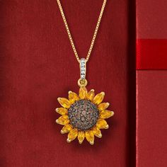 Ross-Simons - 1.70ct t. w. Citrine, .80ct t. w. Smoky Quartz, .10ct t. w. White Topaz Sunflower Pendant Necklace Over Sterling. 18". Sunny and bright, this sunflower pendant necklace will always be able to put a smile on your face. 1.70 ct. t. w. marquise and pear-shaped citrine petals crown the seed-like .80 ct. t. w. smoky quartz in black rhodium center. Crafted in polished 18kt yellow gold over sterling silver. .10 ct. t. w. white topaz single bale suspends from a box chain with a 2" extender