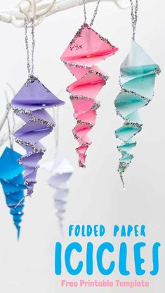 folded paper icicles hanging from a branch with text overlay that reads folded paper icicles free printable template