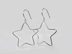 BIG STAR EARRING These all seasons earrings draws attention to your natural beauty! Made with rhodium plated sterling silver. Details: ♥ 925 Sterling Silver ♥ Earring thickness 1.3 mm. ♥ Earring long 60 mm. ♥ Hypoallergenic ( Nickel free ) ♥ Sold in pairs All jewelry comes in beautiful packaging, ready to give, just perfect for that special gift! Want to see more item? www.etsy.com/shop/Lessaremore Feel free to contact me with any questions :) Thank you so much for looking ♥ Sterling Silver Star-shaped Hoop Earrings, Sterling Silver Star Hoop Earrings With Ear Wire, Hypoallergenic Star-shaped Sterling Silver Hoop Earrings, Hypoallergenic Sterling Silver Star Hoop Earrings, Big Star Earrings, Star Earrings Silver, Earring Long, Silver Star Earrings, Thumb Rings Silver