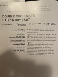 a close up of a piece of paper with words on it and an image of a chocolate raspberry tart