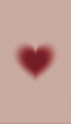 a red heart shaped shadow on a pink background