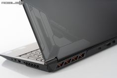 an open laptop computer sitting on top of a white table