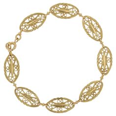 Bracelet in 18 karat yellow gold, eagle head hallmark. Charming bracelet of antique inspiration, it is formed of 8 links separated by a gold clasp. Each link is oval and openwork filigree. The clasp is a spring ring. Length : 20 cm, height of the central motifs : 10 mm, thickness : 1.6 mm. Total weight of the jewel : 14 g approximately. New jewel inspired by the Belle Epoque bracelets. Our opinion : A gold bracelet with a very nice finish. Gold Filigree Bracelet, Filigree Bracelet, Gold Baroque, Gold Eagle, Gold Armband, Big Diamond, Eagle Head, Antique Inspiration, Gold Filigree