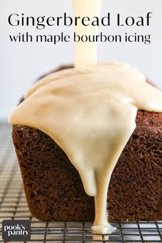 a close up of a loaf of bread with icing being drizzled on it