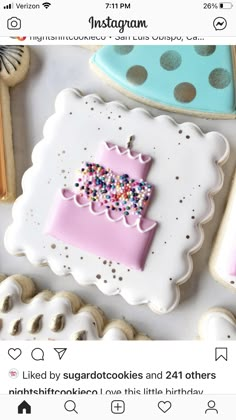 some decorated cookies are sitting on a table