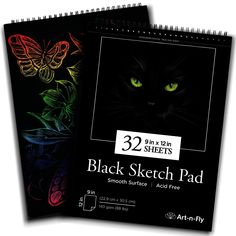 the black sketch pad is next to an image of a cat