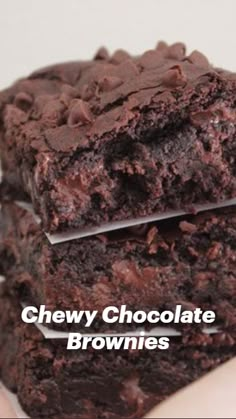 two brownies stacked on top of each other with the words chewy chocolate brownies