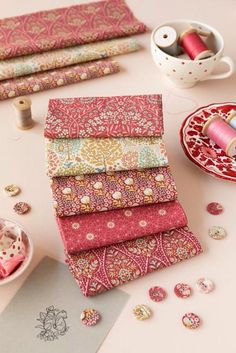 the table is covered with different types of fabric