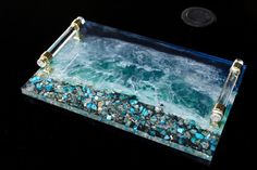 a glass tray that has some rocks in it