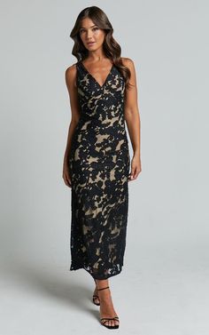 Get ready to turn heads in the Zymae Midi Dress - a stunning black lace slip dress that will make you feel like the life of the party. This elegant, yet sexy dress features a deep V neck and sleeveless design, perfect for showing off your confidence and style. Made from high-quality spandex material, this midi dress is both comfortable and figure-flattering. Whether you're attending a formal event or hitting the town for a night out with friends, the Zymae Midi Dress is guaranteed to make you lo Formal Party Dress Midi Lace, Fancy Cocktail Dress, Nude Cocktail Dresses, Black Lace Slip Dress, Black Lace Midi Dress, Fancy Frocks, Mother Of Groom Dresses, Cocktail Dress Wedding, Groom Dresses