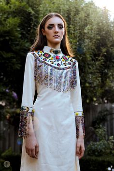 Tabora Beaded Fringe Dress: African embroidered rainbow Hmong Beading, Bead Fringe Dress, Bohemian Embroidered Embellished Dress For Spring, Spring Festival Dress With Beaded Fringe, Spring Bohemian Embroidered Embellished Dress, Spring Bohemian Embellished Embroidered Dress, Traditional Multicolor Tassel Dress, Diy Fringe Dress, Traditional Multicolor Dresses With Tassels