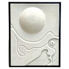 a white tile with an image of a bird and a ball in the middle of it