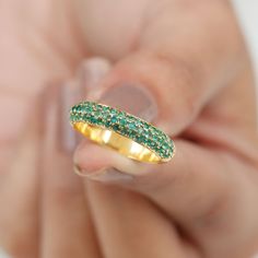 Product Details Enhance your beauty with the fine elegance of this Pave Set Emerald Band Ring. This opulent piece showcases the Emerald Stones set in a half eternity band, creating a captivating and timeless design. Embrace the distinct style this Emerald Ring offers and elevate your look with its exquisite charm. Product Information SKU SHP-RINGS0821193307 Width 1.9 mm Height 3.5 mm Weight 3.28 gm (Approximate) EMERALD INFORMATION No.of Stones 55 Pieces Total Weight 1.07 Carat (Approximate) Dimension(approx) Round-1.50X1.50 mm-36 PcsRound-1.60X1.60 mm-19 Pcs Color Green Cut Brilliant Shape Round Setting Type Pave Setting Quality Grade AAA View More Product Parent Collection Handle wedding-rings Emerald Band Ring, Emerald Band, Enhance Your Beauty, Half Eternity Band, Eternity Band Ring, 18k Yellow Gold Ring, Pave Setting, Emerald Stone, Ring Sizer