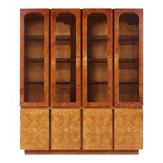 an art deco bookcase with glass doors on the front and sides, in burlwood