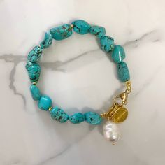 "Andromeda" bracelet regular size  This is an easy to wear  bracelet made of  irregular cut howlite stones in turquoise color tone . it is a easy to wear in everyday life . bracelet is decorated with a beautiful baroque pearl .  classical summer Basics .  it comes in two sizes and two metal details color tones , as linked to options in the drop menu .  💫please note that the shape of the stones will slightly vary .  💫it is an ideal gift idea  🔆you may also check my collection in the TURQUOISE Natural Stone Bracelets For Gifts, Natural Stone Howlite Bracelets As Gift, Turquoise Howlite Bracelets With Natural Stones, Turquoise Natural Stone Bracelets, Gem Stone Bracelet, Wire Wrapped Stone Jewelry, Bracelet Summer, Howlite Bracelet, Summer Bracelet