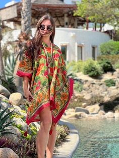 Our Frida Floral kaftan is named after none other than the inimitable Frida Kahlo. We are certain that if Frida lived today she would be roaming about in this gorgeous kaftan for sure! Brighten up everyone's day when you wear this amazingly colourful kaftan! 100% cotton 34" length One size with adjustable drawstring waist Delicate cold wash in lingerie bag to protect tassels, or hand wash cold with a midl detergent. Hang dry. This fabric is block printed by hand, creating subtle variations in th Short Kaftan, Cotton Kaftan, Live Today, Floral Short, Drawstring Waist, Block Print, Tassels, Hand Wash, Lingerie