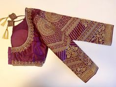 Machine crafted with zari embroidery, this Purple long sleeve Ready Blouse adds a touch of elegance to your saree or lehanga. The intricate work make it a versatile choice for any occasion. Upgrade your wardrobe with this stunning piece. Made to fit size 36" alterable upto 38” Dry clean only Bollywood Style Formal Blouse With Intricate Embroidery, Formal Resham Embroidery Blouse Piece For Navratri, Formal Saree Blouse Piece With Intricate Embroidery, Formal Blouse Piece With Resham Embroidery For Navratri, Formal Embroidered Unstitched Blouse Piece, Long Sleeve Lehenga With Intricate Embroidery For Eid, Traditional Saree With Intricate Embroidery For Formal Occasions, Formal Blouse With Zari Work For Eid, Formal Saree Blouse Piece Embroidered