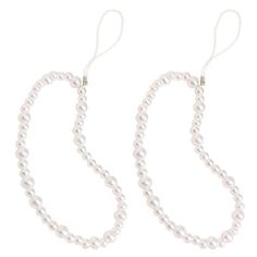 two white pearls are hanging from the end of a pair of ear wires on a white background