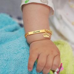 These bracelets are ion plated (IP) with 14K yellow gold on top of hypoallergenic stainless steel, and won't turn baby or reborn doll's skin, or vinyl, green. Click here for silver, here for rose gold. Limits: 2 lines maximum, 20 characters per line including spaces. When checking out, you will be able to leave me a note for the name you wish to have engraved. If you forget, no problem, just message me. Length: 12cm Imported with care from Singapore. Please allow 1 to 2 business days for process Baby Crown, Customised Bracelets, Kids Bracelets, Baby Bracelet, Gold Engraving, Id Bracelets, Perfect Baby Shower Gift, Name Bracelet, Personalized Christmas Gifts