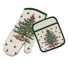 two oven mitts with christmas trees on them and one has an oven mitt