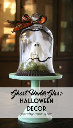 a ghost under glass halloween decoration on a table with text overlay that reads, ghost under glass halloween decor