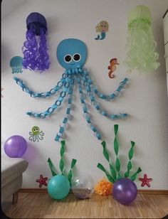 an octopus and jellyfish decoration on the wall