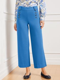 An elevated take on your favorite wide leg pants, in a versatile cropped length. Knit with fabulous draping and flattering high waist. Sailor buttons at the front completes the maritime-inspired look. Wear-to-work (and after) perfection. Features Wide Leg Hits Above Waist Crop Length Side zip closure Imported Fit: Misses: 26"; Petite: 22 1/2"; Plus: 26"; Plus Petite: 22 1/2" Material: 69% Rayon, 25% Nylon, 6% Spandex Care: Machine Wash Cold; Only Non-Chlorine Bleach When Needed; Turn Garment Ins Cropped Leg Workwear Bottoms With Buttons, Chic Wide Leg Ankle-length Pants With Buttons, Chic Ankle-length Wide Leg Pants With Buttons, Versatile High Waist Bottoms With Buttons, Wide Leg Cropped Pants, Classic Style Women, Capri Blue, Crop Pants, Event Styling