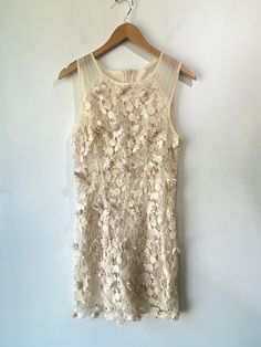 Thistlepearl Cream Embroidered Dress! Cotton exterior, fully lined. Zipper on the back. Marked a size 6, please refer to measurements. In excellent condition! Approx. Measurements: Underarm to Underarm: 17" Waist: 29" Length: 35" Elegant Lace Embroidered Dress With Floral Applique, Elegant Beige Dress With Floral Applique, Chic Sleeveless Dresses With Pearl Embroidery, Chic Fitted Embroidered Dress, Embroidered Lace Dress For Evening, Spring Wedding Dresses With Pearl Embroidery, Spring Sleeveless Dress With Pearl Embroidery, Elegant Fitted Beige Embroidered Dress, Cream Sleeveless Dress With Floral Applique