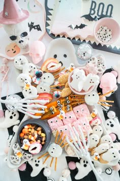 a table topped with lots of halloween treats