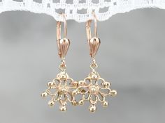 Crafted of warm yellow and rose gold these are the perfect wardrobe basic. Elegant and sensual, these hang perfectly, just below the ear, and are versatile enough to wear with any neckline! Metal: 14K Yellow and Rose Gold Earrings Length: 29 mm Earrings Width: 13 mm Marks: "14K" Stamped on the Findings Cheap Gold Filigree Earrings, Drop Earrings Gold, Gold Dangle Earrings, Warm Yellow, Perfect Wardrobe, Gold Earrings Dangle, Gold Drop Earrings, Rose Gold Earrings, Eternity Bands