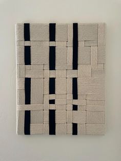 a white wall with black squares on it