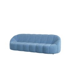 a blue couch sitting on top of a white floor